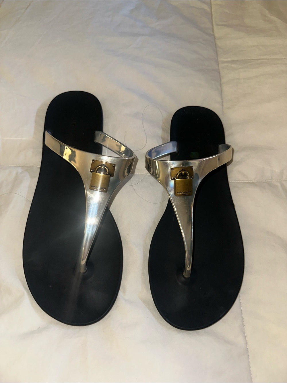Kurt Geiger Silver Metallic T-strap Thong Sandals with Gold Logo Accent